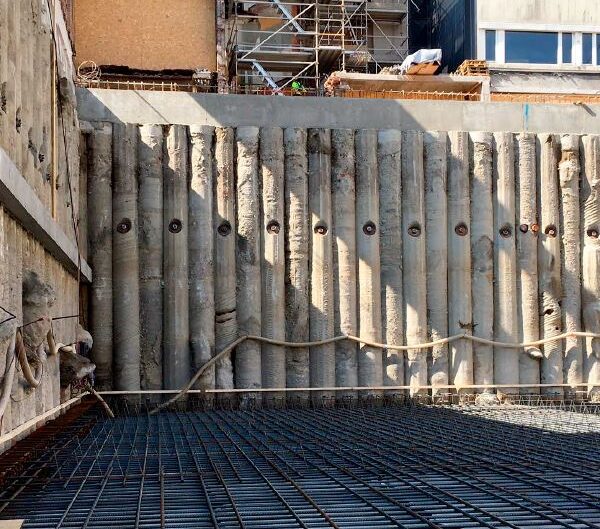 Completed secant pile wall