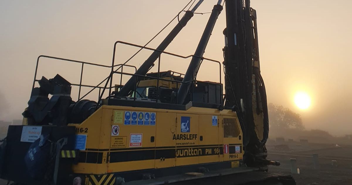 a wideshot of a piling rig at dusk